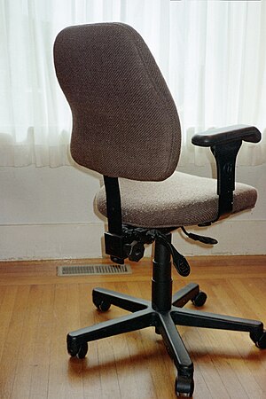 English: An office chair that can swivel and b...