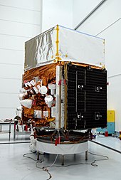 Fermi on Earth, solar arrays folded GLAST on the payload attach fitting.jpg