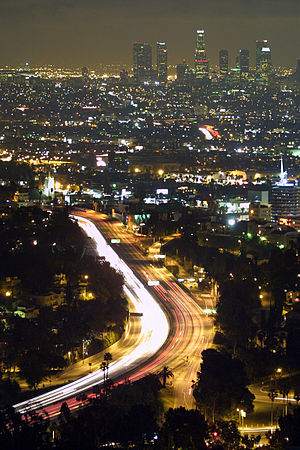 Nighttime view of Downtown L.A. and the Hollyw...