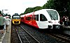 Two trains load passengers at Bad Nieuweschans station in 2006