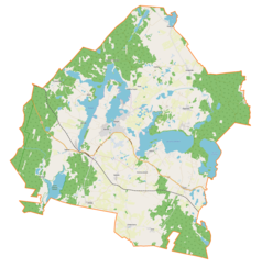 Mapa konturowa gminy Pasym, blisko centrum na lewo znajduje się punkt z opisem „Pasym”