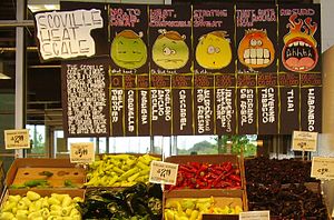 A display of hot peppers and a board explainin...