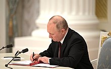 Vladimir Putin signs presidential decrees recognizing the DPR and LPR and treaties of friendship, cooperation and mutual assistance, 21 February 2022 Putin - DNR, LNR (2022-02-21) 02.jpg