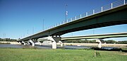 From the south bank, upstream of the bridges