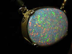 31ct Crystal Opal Pendent set in 14k gold with Green Diamond Accents.JPG