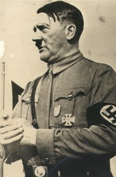 Hitler in his brownshirt SA uniform wearing the Nuremberg Party Day Badge and his World War I Iron Cross Adolf Hitler 1, sem data.tif