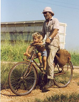 Father and son on bicycle, Cuba, 1994.
