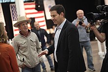 Mark Halperin with co-host Mark McKinnon at the 2015 Iowa Growth & Opportunity Party, Varied Industries Building, Iowa State Fairgrounds, Des Moines, Iowa, during shooting of The Circus Halperin-Iowa.jpg