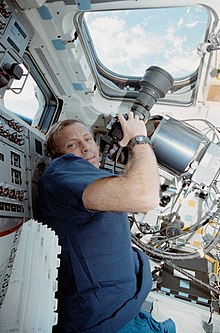 Space Shuttle astronaut Kenneth Cockrell with a digital Nikon NASA F4 HERCULES Kenneth Cockrell on Discovery with the HERCULES camera system (STS056-08-018).jpg