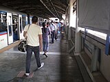 Vast platform area with a train in the station