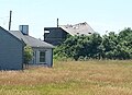 Storm-damaged former fire control tower resembling a beach cottage, former Fort Greene south reservation