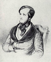 The head and upper body of a young white man with dark hair receding where it is parted on the left. Sideburns run the full length of his face. He wears a cravat and his right hand is tucked between the buttons of his coat.