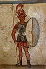 Fresco of an ancient Makedonian soldier (thorakitai) wearing chainmail armor and bearing a thureos shield, 3rd century BC
