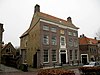 Groot herenhuis van vijf traveeën "De Vier Heemskinderen"