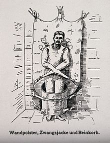 A patient in a strait-jacket and barrel contraption, 1908 A mentally ill patient in a strait-jacket attached to the wa Wellcome V0016643ER.jpg
