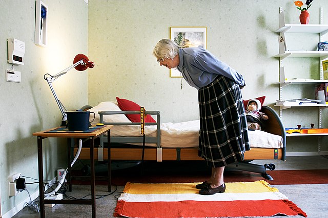 elderly woman in room