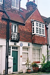 Colour photograph of the front of a three-storey house