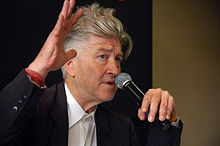 David Lynch speaks before a group.