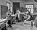 Image 24Students in a carpentry trade school learning woodworking skills, c. 1920 (from Vocational school)