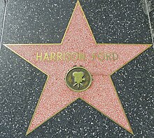 Harrison Ford's star, presented to the actor in 2003. The silent film actor of the same name has an identical star in a different location on Hollywood Boulevard HarrisonFordHWoFOct10.jpg