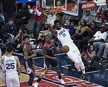 Joel Embiid dunking the ball during a 2018 76ers game was named the team's fifth NBA Most Valuable Player in 2023 Joel Embiid 2018.jpg