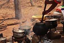 Kalanga_woman_steering_chimonye_meal_(Kalanga)_at_Domboshaba_cultural_festival