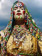 Albanian woman decorated for the Illyrian carnivals, during the Albanian spring festival of the Sharr Mountains. Karnevalet ilire.jpg