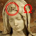 guba omega (Ω) na Marijini glavi
