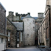 The round tower (apparently known as the Ivy Tower) from ca. 1525 is one of the oldest parts of King's College (the University of Aberdeen) but it is now almost surrounded by later buildings. Round Tower, King's College, University of Aberdeen.jpg
