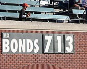 A sign in the outfield of Bonds' home park depicting his chase of Babe Ruth's 714 home runs.