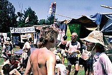 People canvassing for the Values Party, considered the world's first national-level environmentalist party, at Nambassa,1979 Values Party canvassing at Nambassa 1979 & 1981, New Zealand 1.jpg