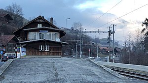 Three-story station building with gabled roof