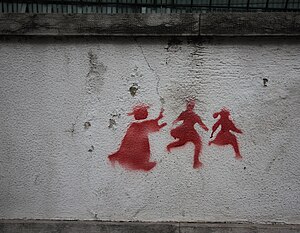 English: Graffiti on a wall in Lisbon depictin...