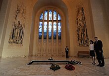 The Tomb of the Unknown Australian Soldier in the Hall of Memory, with Napier Waller's mosaics and stained glass windows in the background. Defense.gov photo essay 100216-F-6655M-017.jpg