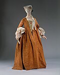 Robe battante. Tidig version: lös runt överkroppen. 1720