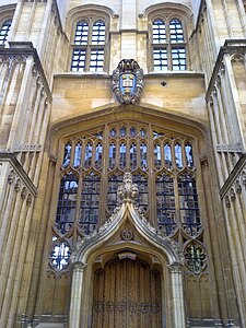 The external door, added by Christopher Wren in 1669 for access to the Sheldonian Theatre,[1] mounted with the University coat of arms.