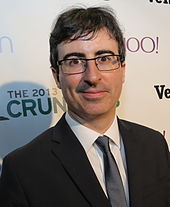 Headshot of comedian John Oliver