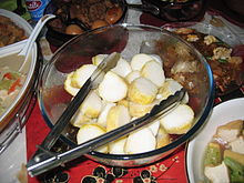 Lontong, popular in Indonesia and Malaysia, made of compressed rice rolled into a banana leaf Lontong.jpg