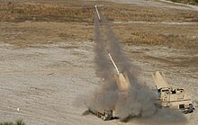 An Assault Breacher Vehicle launching a line charge M1 Assault Breacher Vehicle.jpg