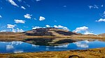 A lake in high-altitude area with sparse vegetation