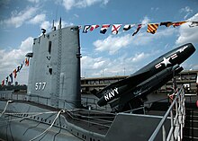 USS Growler, one of two submarines designed to provide a nuclear deterrence using cruise missiles with a 500-mile (800 km) range--placed on patrol by starting to carry the Regulus I missile (shown at Pier 86 in New York, its home as a museum ship) USS Growler SSG-557.jpg