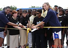 Riley at the ribbon cutting for four donated basketball courts in Angola Angola Basketball dedication 2007.jpg