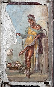 Priapus, wearing a Phrygian cap and weighing his phallus in a balance scale (House of the Vettii, Pompeii) Casa dei vettii, vestibolo, priapo che poggia il fallo sulla bilancia 01.jpg