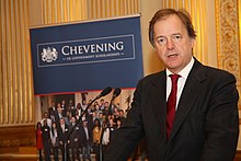 Minister of State for Foreign Affairs Hugo Swire discussing the programme in 2015 Chevening Partnerships event (16731149468).jpg