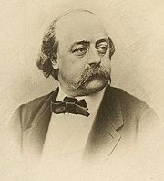 portrait en buste, très connu, noir et blanc, avec moustache et gros nœud-papillon