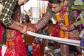 नेपाली हिन्दू विवाह दुलाहबाट सिन्दुर राखिदै ।