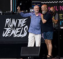 Jeremy Corbyn and Michael Eavis together on the Pyramid Stage at the 2017 Glastonbury Festival Jeremy-Corbyn-Michael-Eavis-Glastonbury-Cropped.jpg