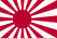 A flag bearing a stylised red sunburst symbol on a white background.