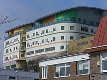 The new Royal Alexandra Children's Hospital rises above the buildings of the Royal Sussex County Hospital. Royal Alexandra Children's Hospital, Brighton (from SE) (April 2013).JPG
