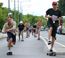 Skateboards are propelled by pushing (one foot riding on board, one foot pushing on ground) or by gravity Stockholm Skateathon 2014 - 03.jpg